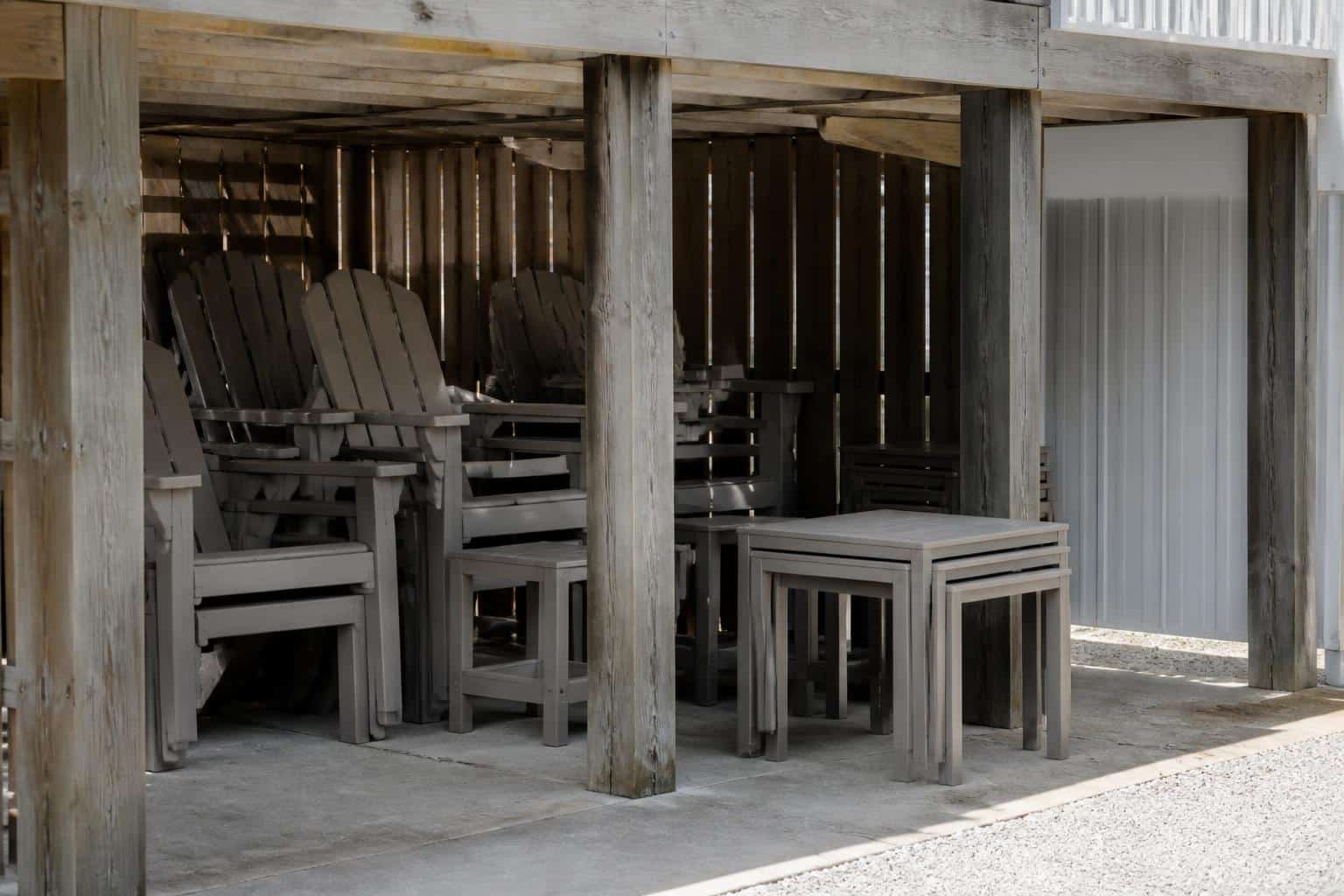 Outdoor furniture grouped in covered storage before a storm