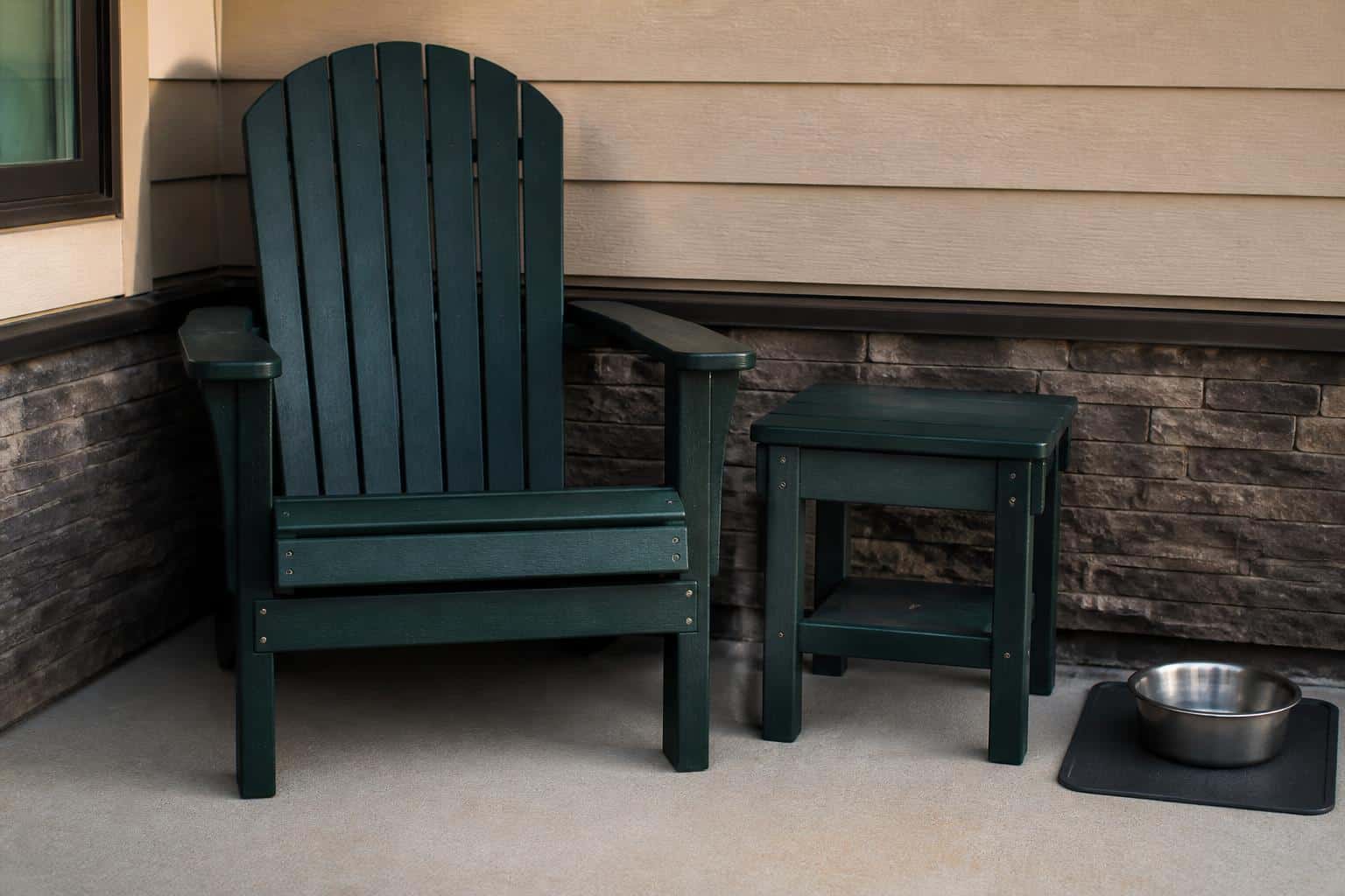 Shaded patio corner with seating near a pet water area