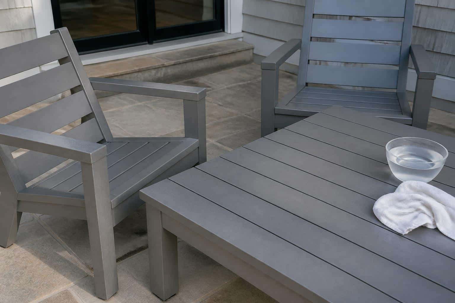 Clean outdoor dining chairs on a patio