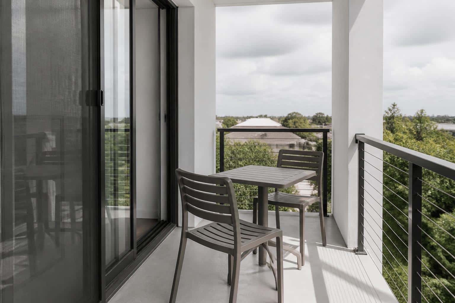 Cafe chairs on a small rental balcony
