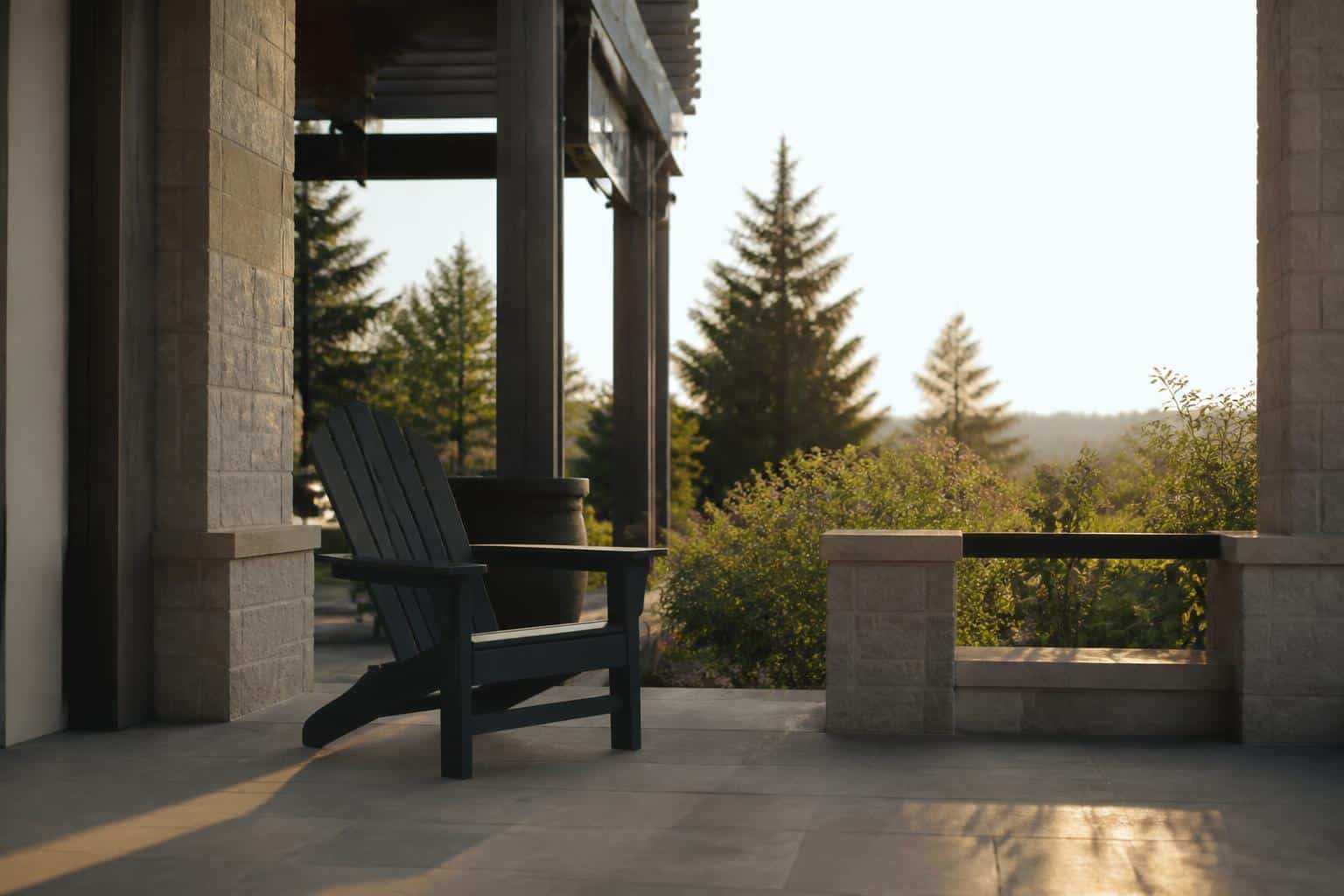 Charcoal adirondack chair under a shaded pergola