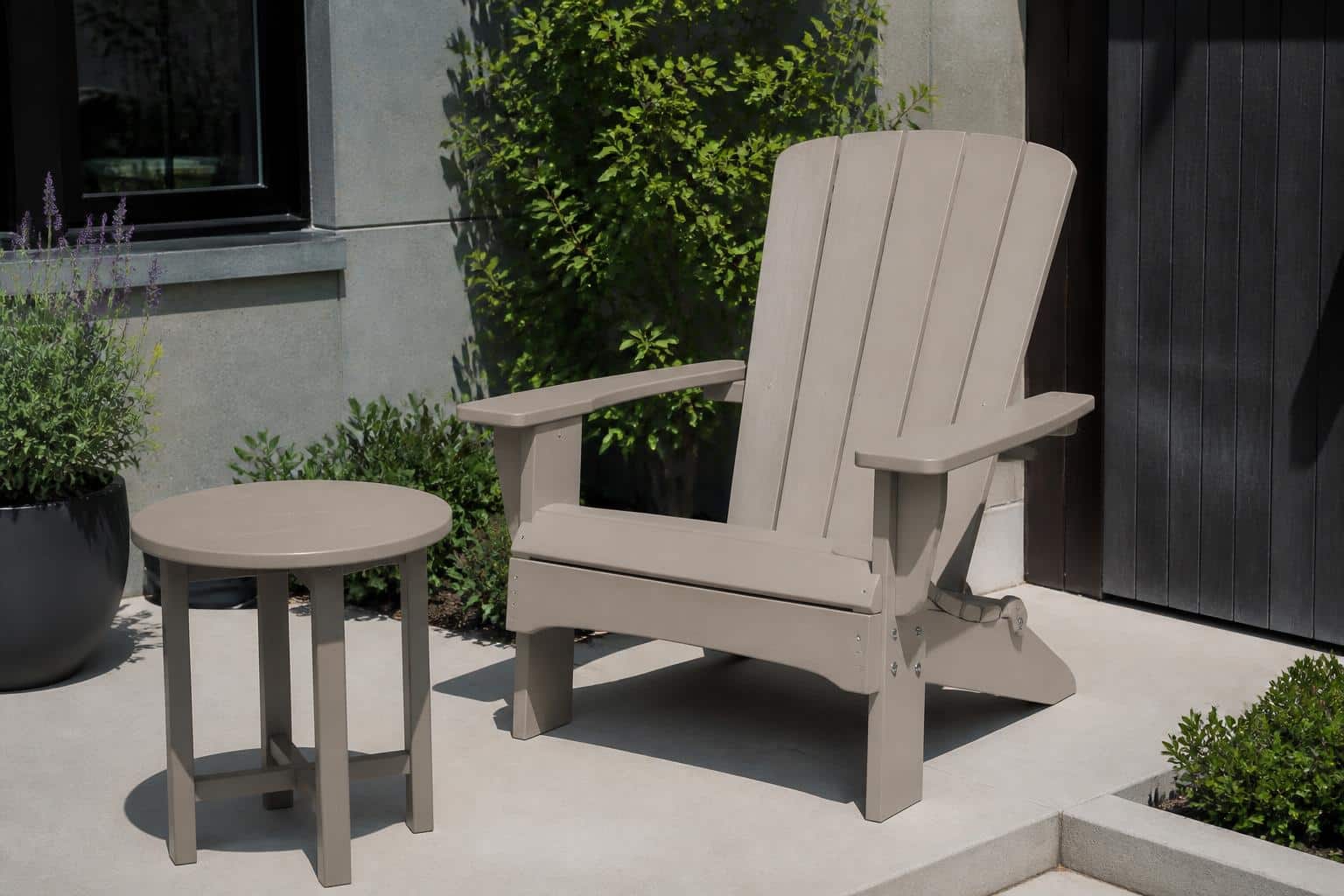 A bright sunlit patio with a poly lumber chair and matching side table