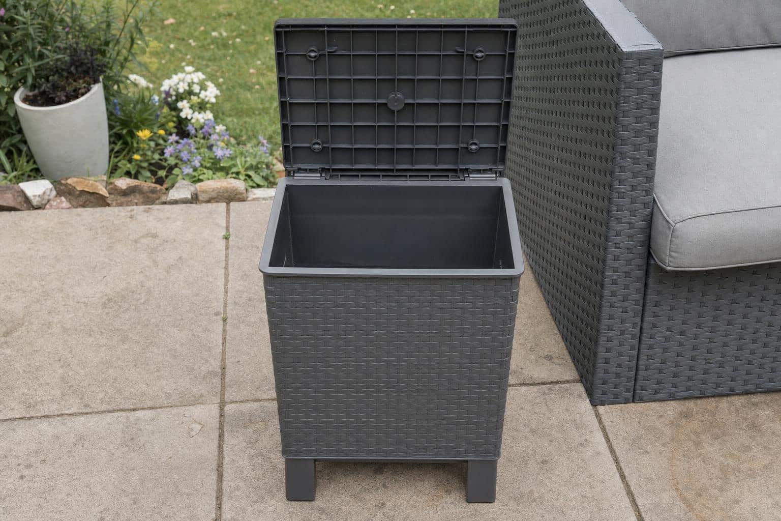 Open empty compartment in a generic outdoor storage side table