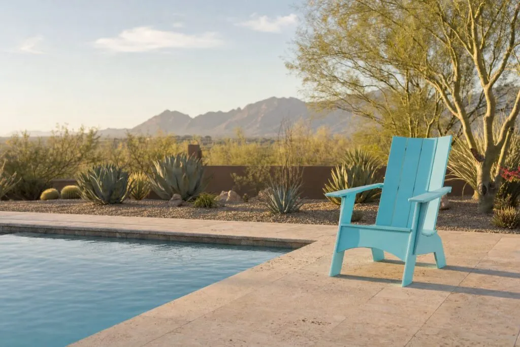 Seafoam Hampton Adirondack Chair on a pool deck in an Arizona backyard