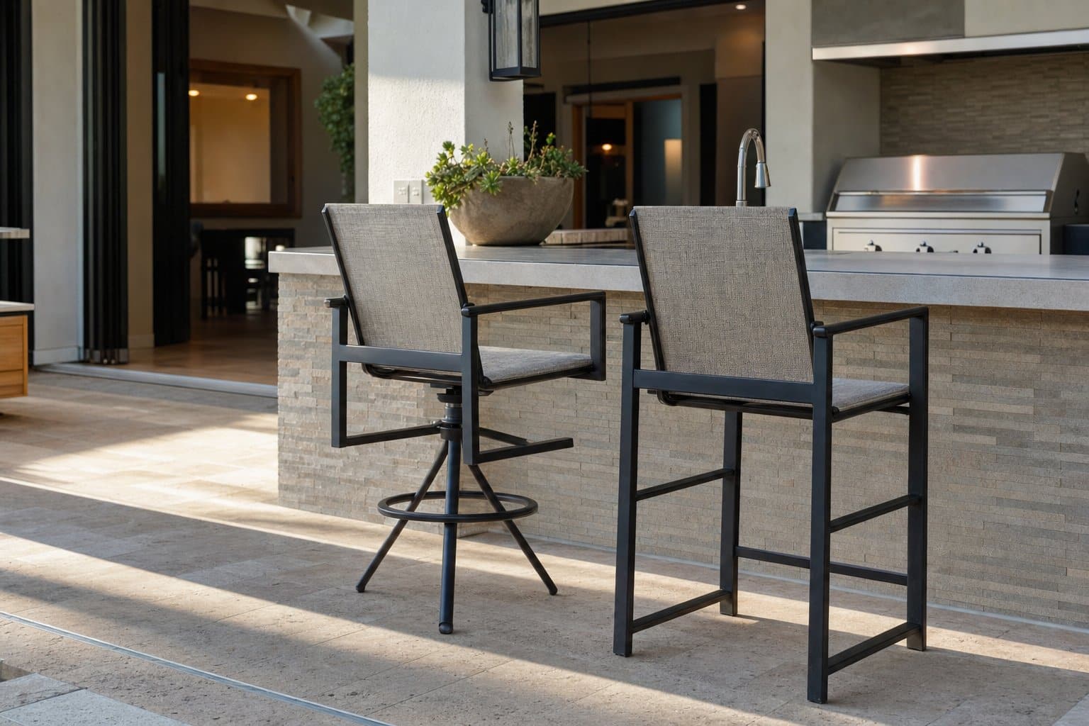Outdoor counter stools with open clearance behind a patio island.